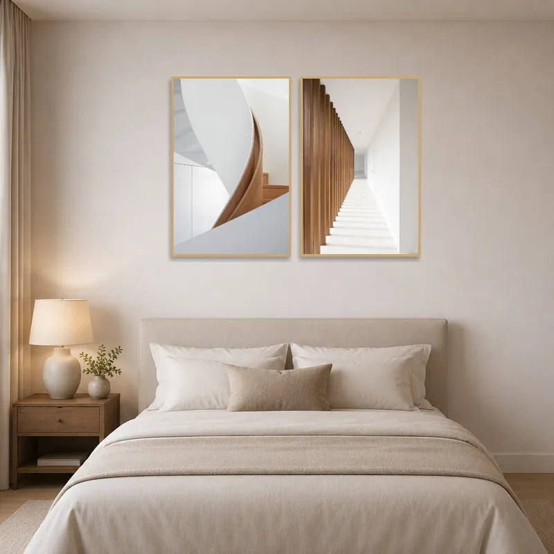 Two stylish prints adding sophistication to a serene bedroom setting.