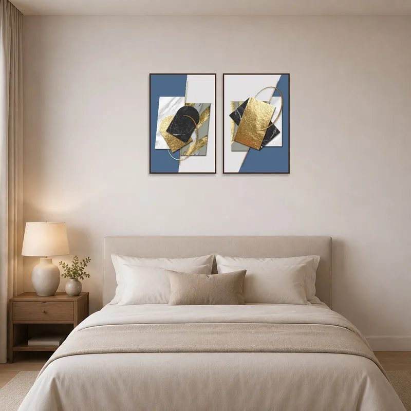 Stylish bedroom features a blue and gold abstract art set above the bed.