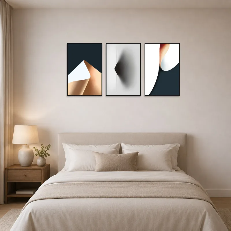 Abstract triptych set enhances bedroom with artistic appeal and dynamic patterns.