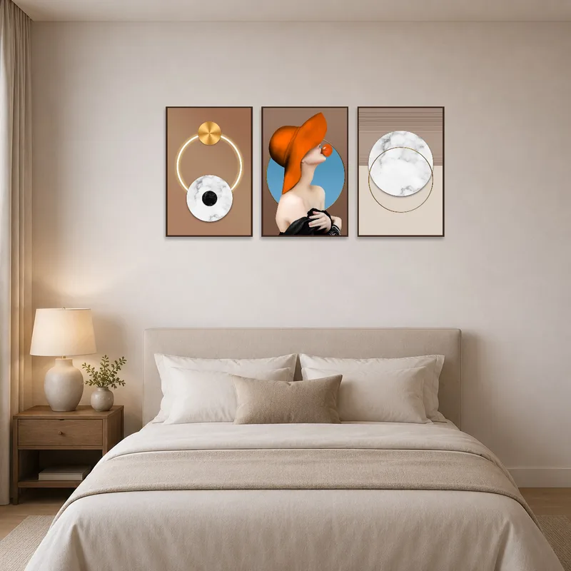 Muted geometric and figurative pieces bring a modern touch to a serene bedroom setting.
