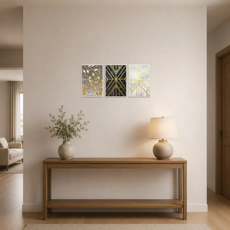 Entrance hall showcasing a stylish triptych with gold geometric patterns and marble accents.