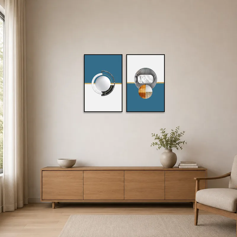 Minimalist room with geometric marble and metal print set complementing simple furnishings.