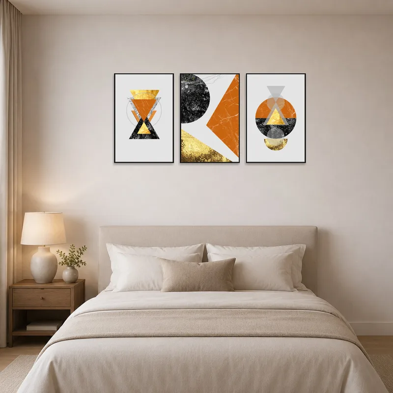 A bold geometric triptych serves as a lively focal point in a serene bedroom setting.