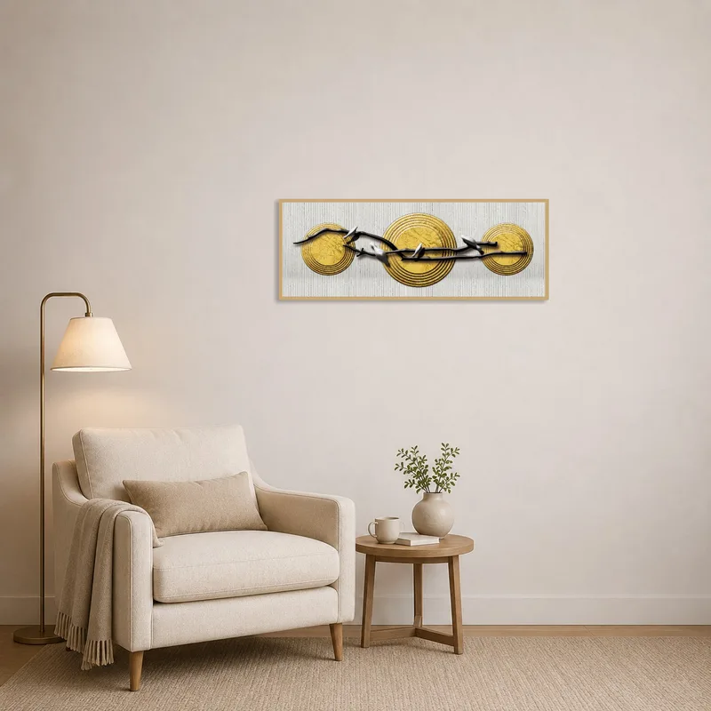 Cozy reading corner with art of golden discs and branches adding warmth to the space.