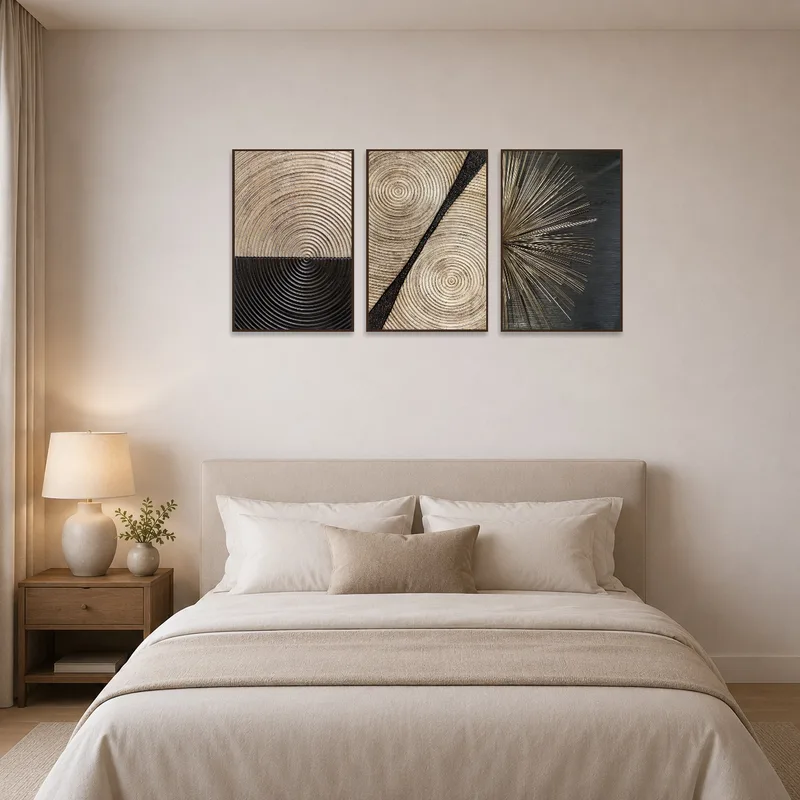 Calming modern triptych above the bed in a tidy bedroom.