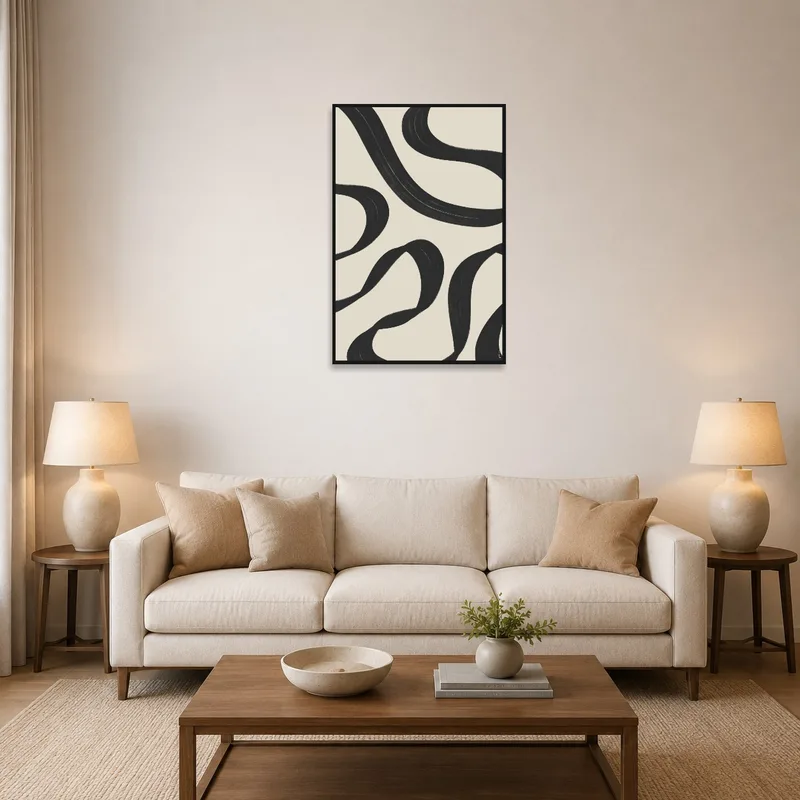 Black swirl artwork above a modern living room sofa.