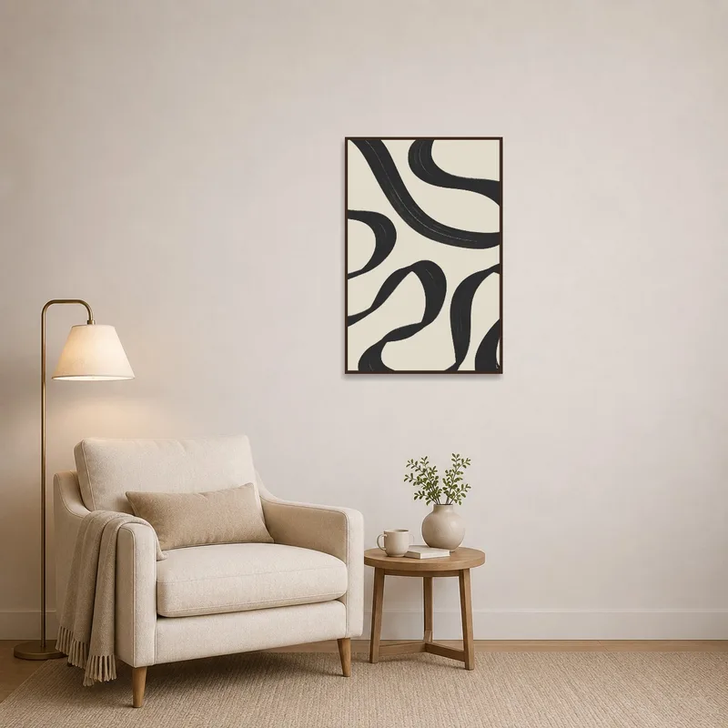Black swirl art adds flair to a cozy reading nook.