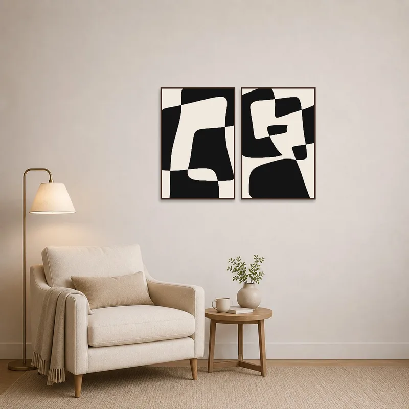 Monochrome geometric artwork enhances a cozy reading corner.