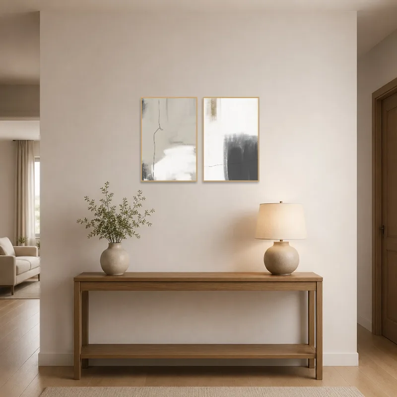 Monochrome art set adding elegance to a stylish entrance hall.