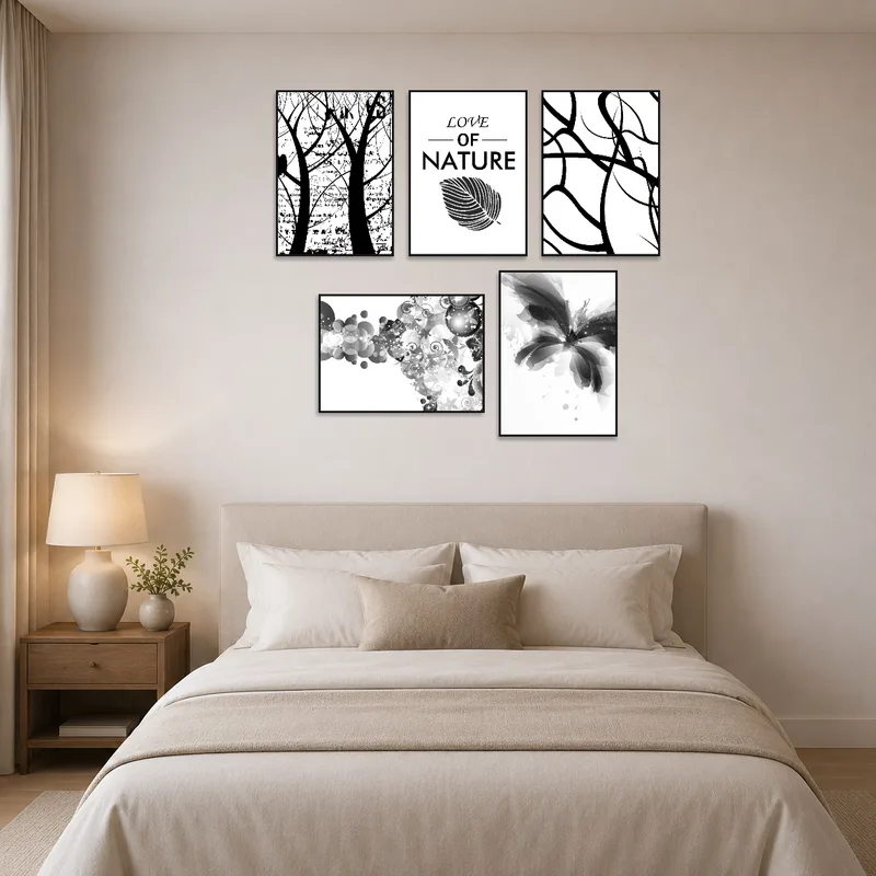 Abstract nature prints in black and white adorn the wall above a stylish bed.