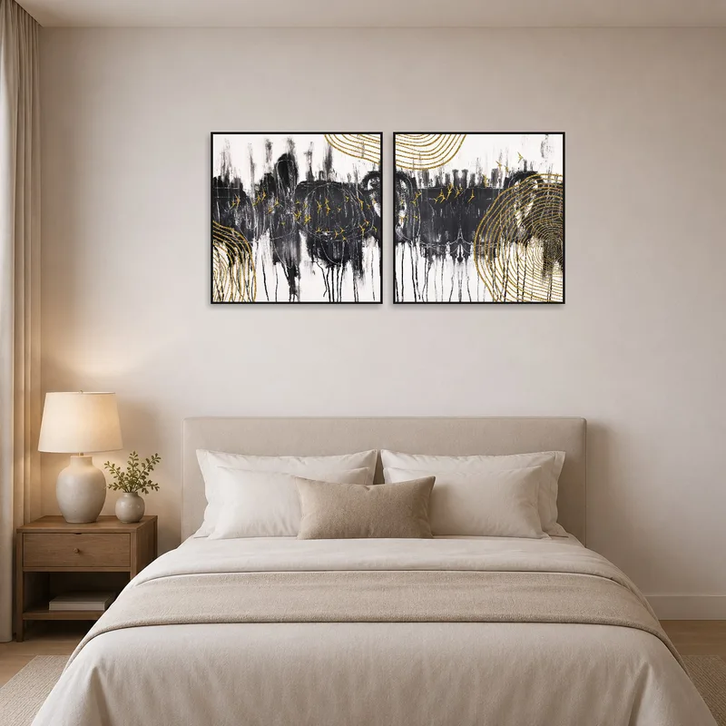 Monochrome abstract set brings sophistication to a tranquil bedroom setting.