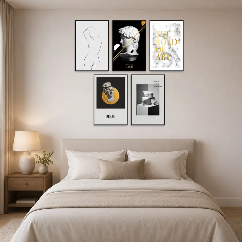 Bedroom adorned with monochrome and gold prints adding a luxurious, calming vibe.