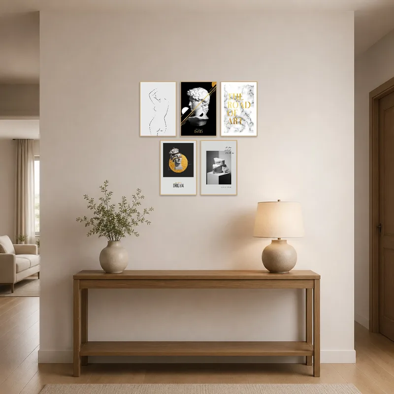 Entrance hall featuring monochrome and gold prints for an inviting first impression.