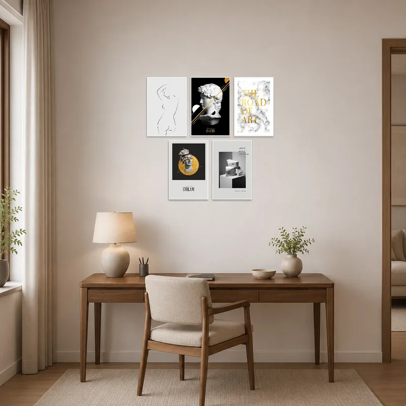 Home office walls featuring monochrome and gold prints inspire creativity and focus.
