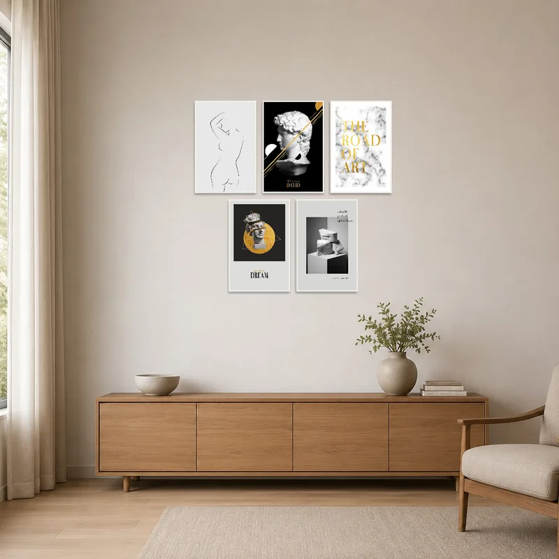 Minimalist room with monochrome and gold artwork for a sleek, stylish look.