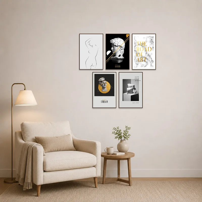 Cozy reading corner with monochrome and gold prints enhances relaxation ambiance.