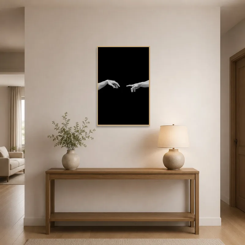 Monochrome hands art print welcomes guests in an elegant entrance hall.