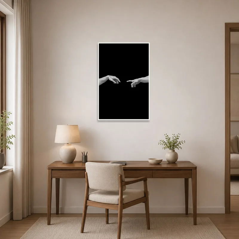 Home office accented by a monochrome hands art print on a neat workspace wall.