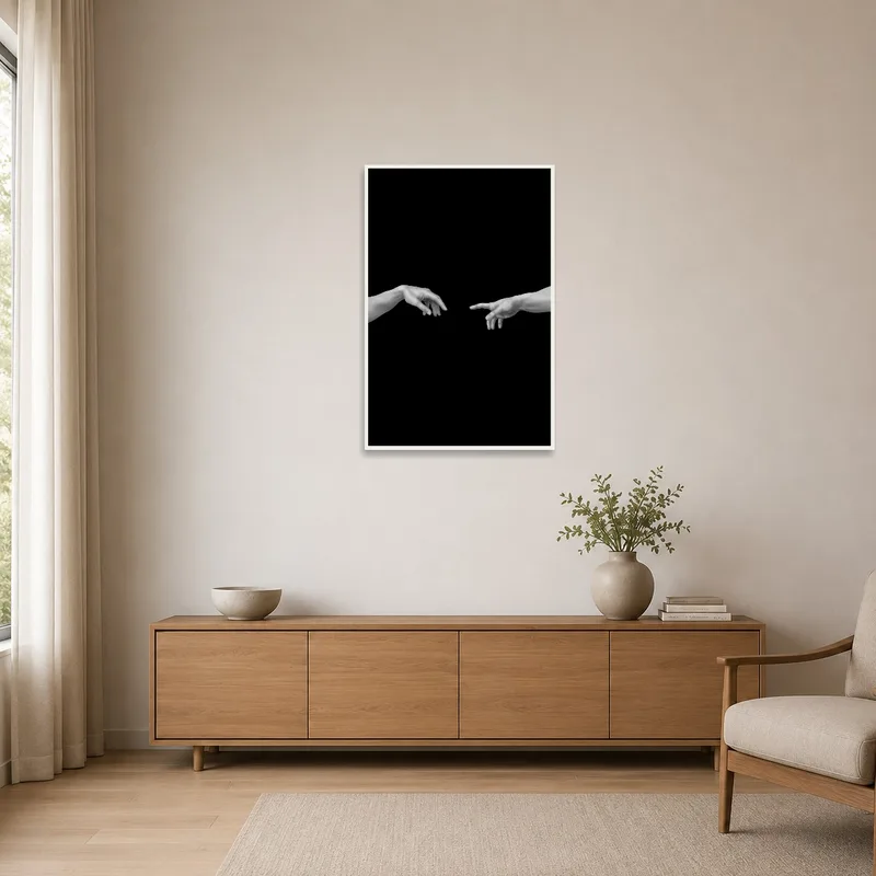 Minimalist room featuring a monochrome hands art print on a stark white wall.