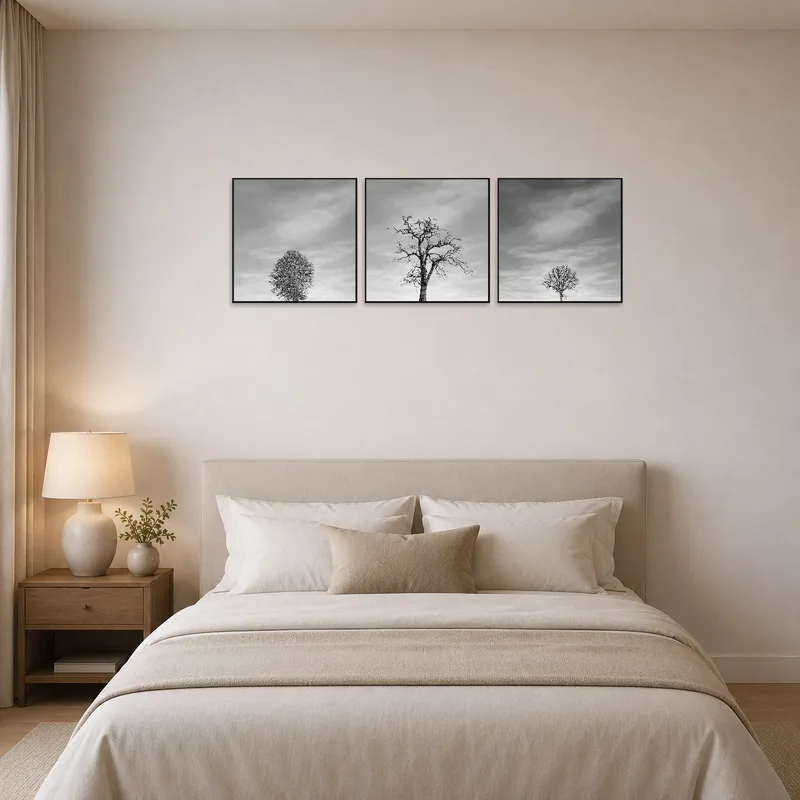 Bedroom with the triptych of tree silhouettes, creating a serene and restful ambiance.