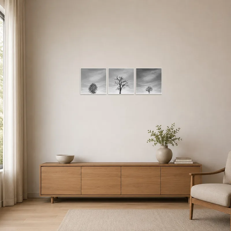 Minimalist room showcasing the triptych of tree silhouettes on a clean, white wall.