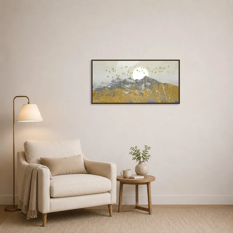 Artwork of mountains, sun, and birds above a cozy reading nook.