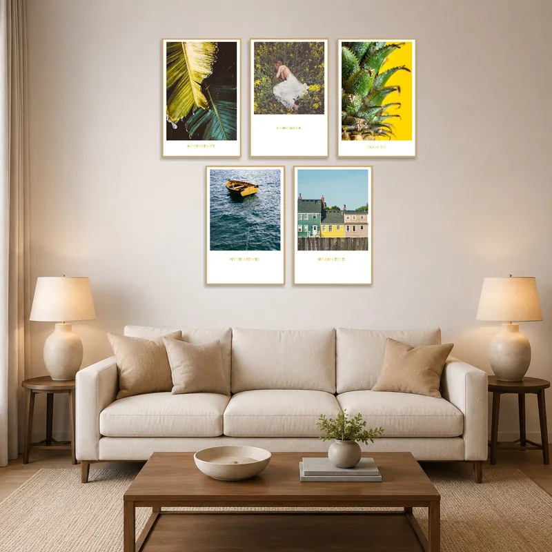 Nature and lifestyle prints on a living room wall above a cozy sofa.