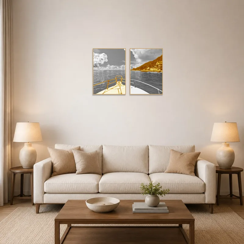 Sepia-toned coastal art adding a maritime touch above a couch and coffee table in an elegant living room.