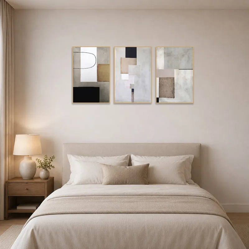 Geometric triptych creates a calming atmosphere in a serene bedroom.