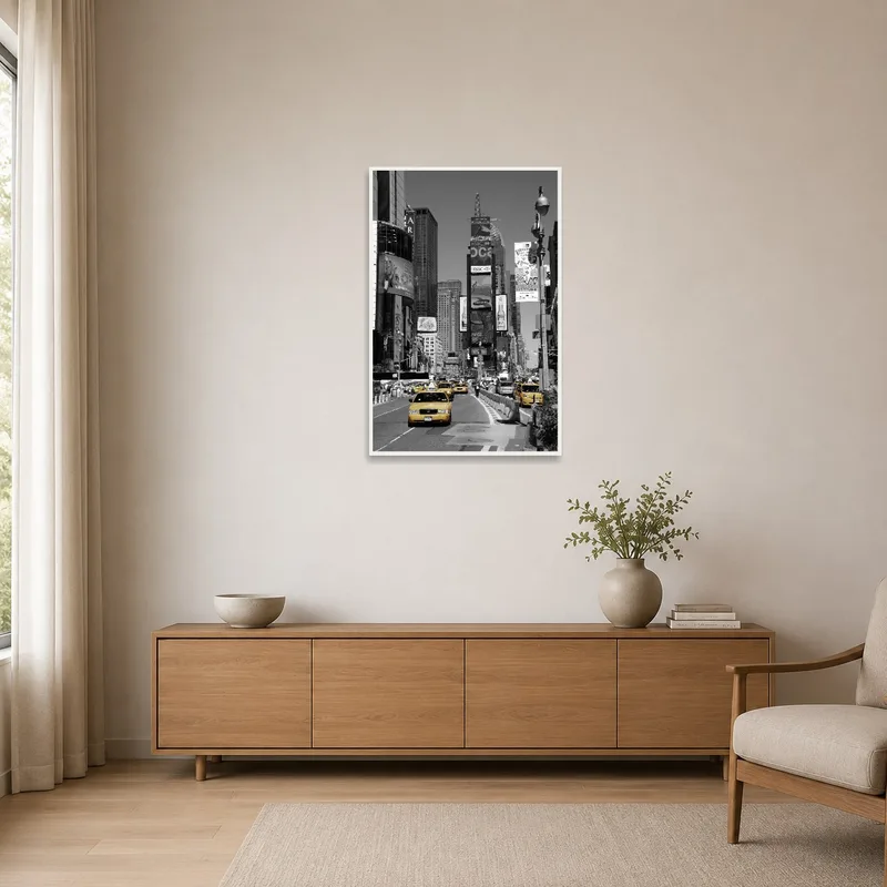 Yellow taxis art piece on a white wall in a minimalist-style room.