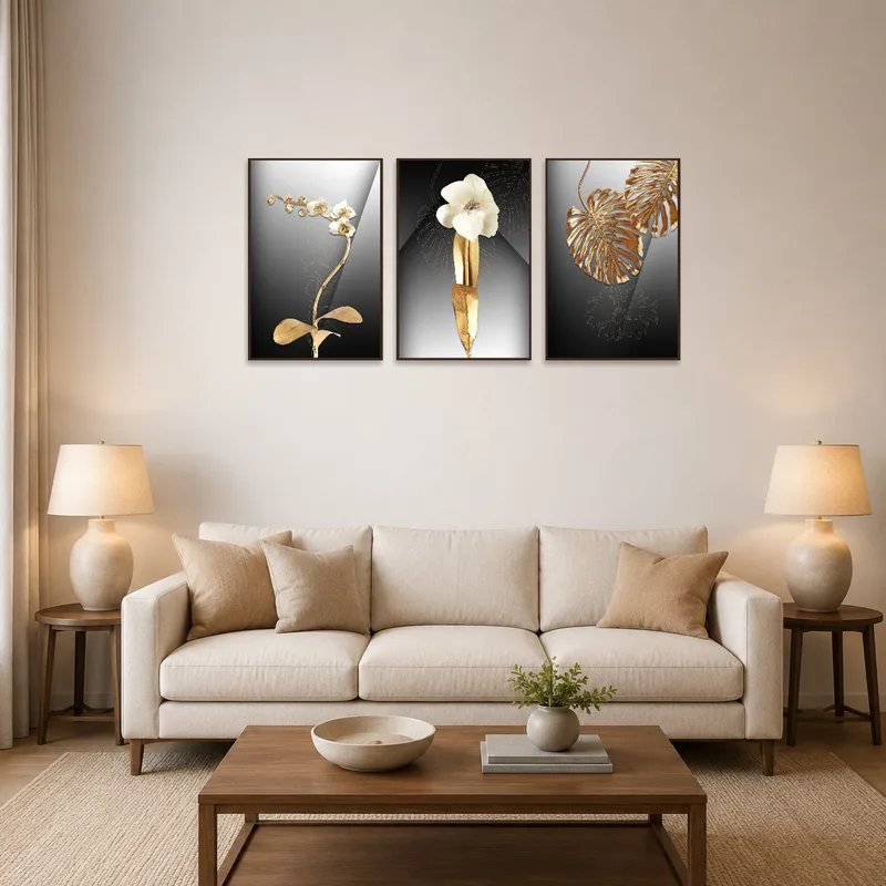 A metallic triptych of orchids and leaves hanging above a modern living room sofa.