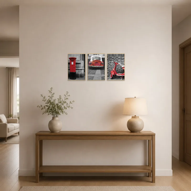 Entrance hall with a striking triptych of red urban vehicles.