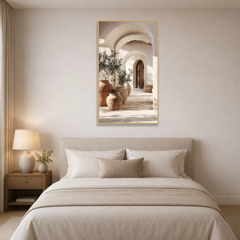 Serene bedroom with a rustic Mediterranean archway and terra cotta vases on the wall.
