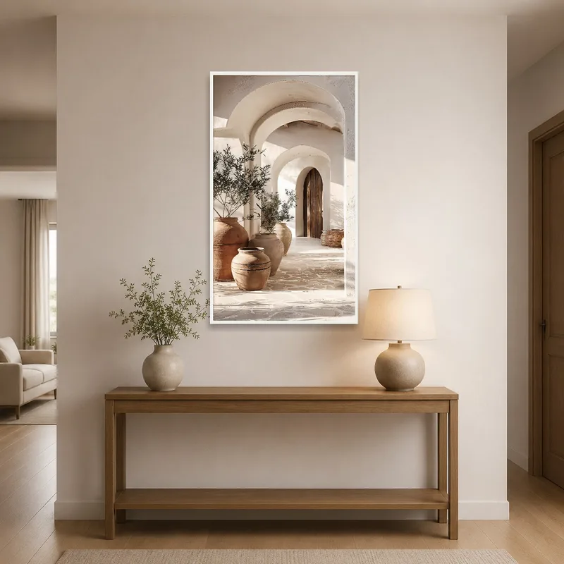 Mediterranean archway and terra cotta vases welcoming visitors in the entrance hall.