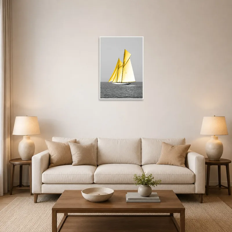 Sailboat with yellow sails displayed in a cozy living room above a modern grey sofa.