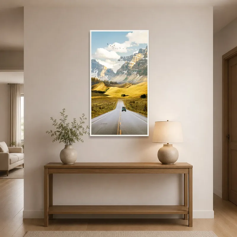 Mountain car scene hangs in an entrance hall, greeting guests with a sense of adventure.