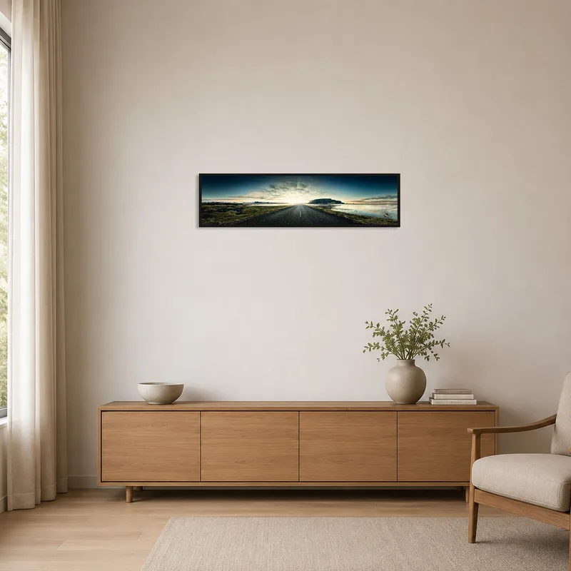 Panoramic print of a scenic road to horizon adding interest to a minimalist room with neutral tones.
