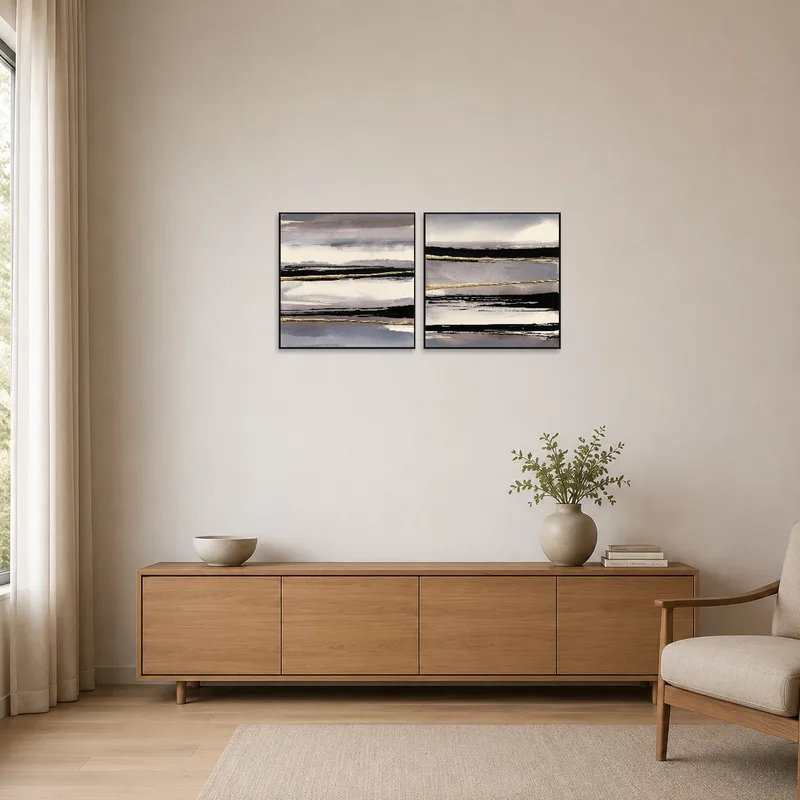 Abstract landscape pair enhancing a minimalist space's subtle elegance.
