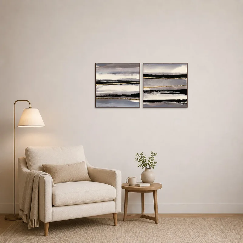 Monochromatic abstract landscapes complementing a cozy reading nook.