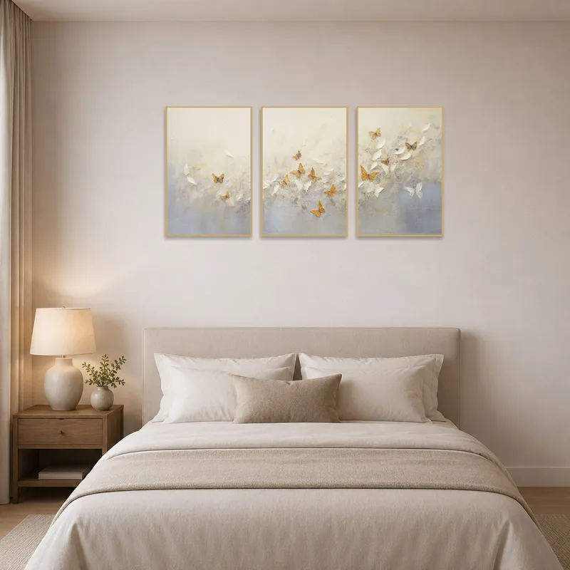 Butterfly triptych brings soothing tones to a peaceful bedroom setting.