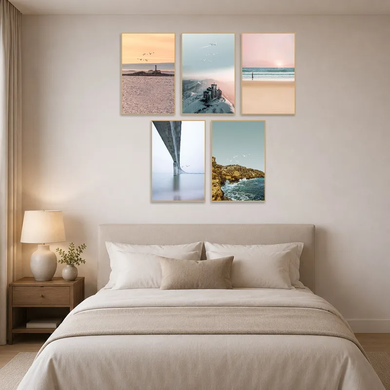 Bedroom with serene coastal and mountain landscape art.