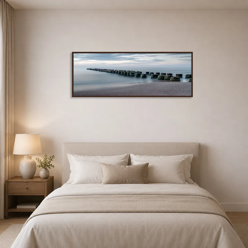 Serene coastal art adds calmness to a bedroom ambiance.
