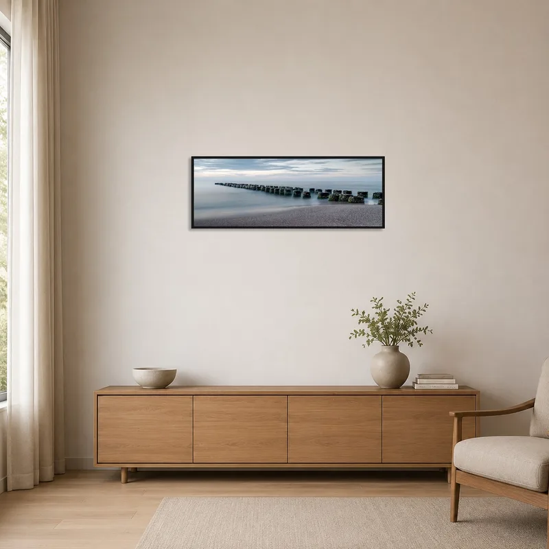 Serene coastal view art adds tranquility to a minimalist space.