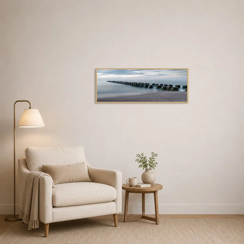 Peaceful coastal scene enhances a quiet reading corner.