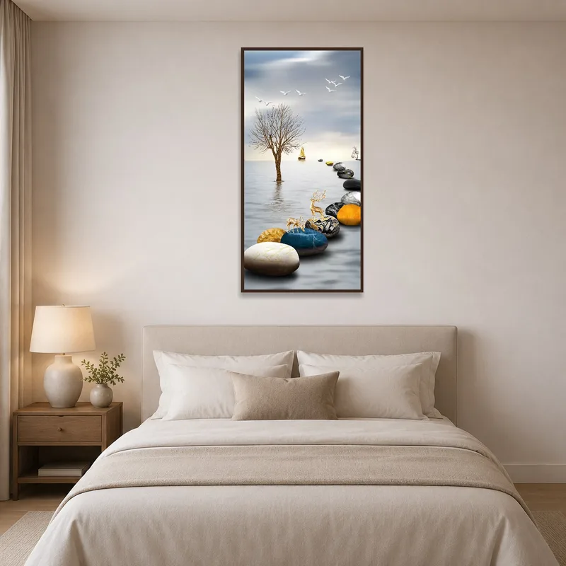 Above a serene bed, the artwork presents a peaceful scene of stones and a sailing boat.