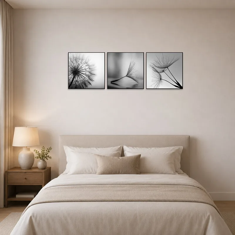 Monochrome dandelion triptych creates a calming atmosphere in the bedroom.