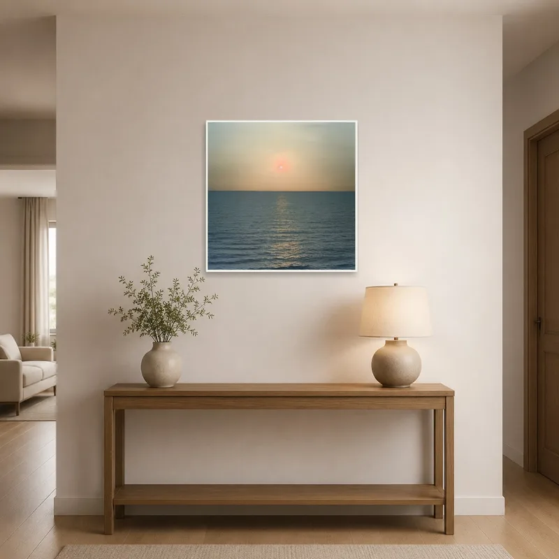 Entrance hall with serene sunset print by the doorway.