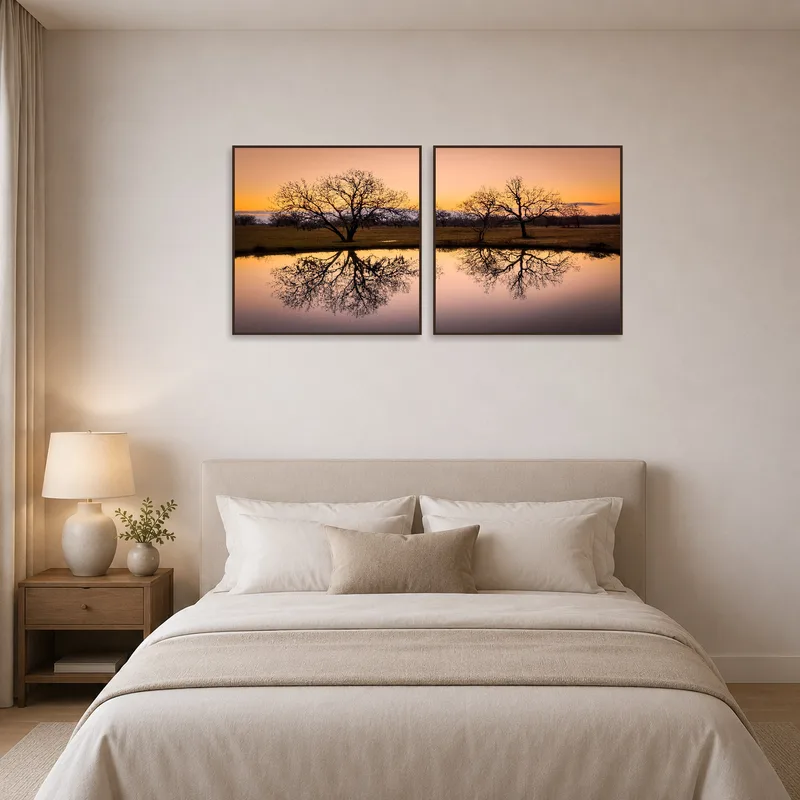 Tranquil sunset imagery above the bed in a serene bedroom.
