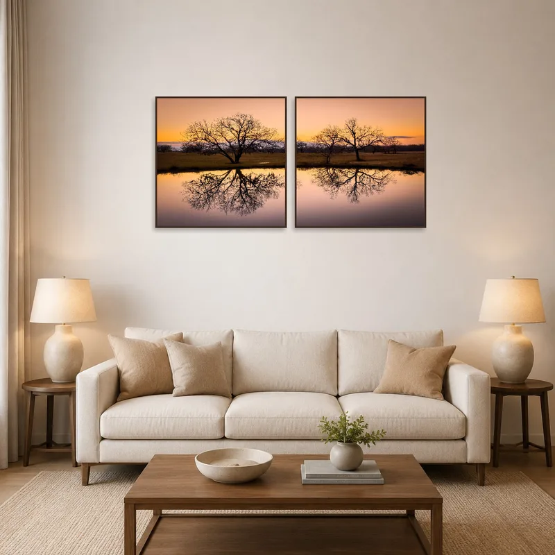 A sunset art piece above a sofa in a cozy living room.