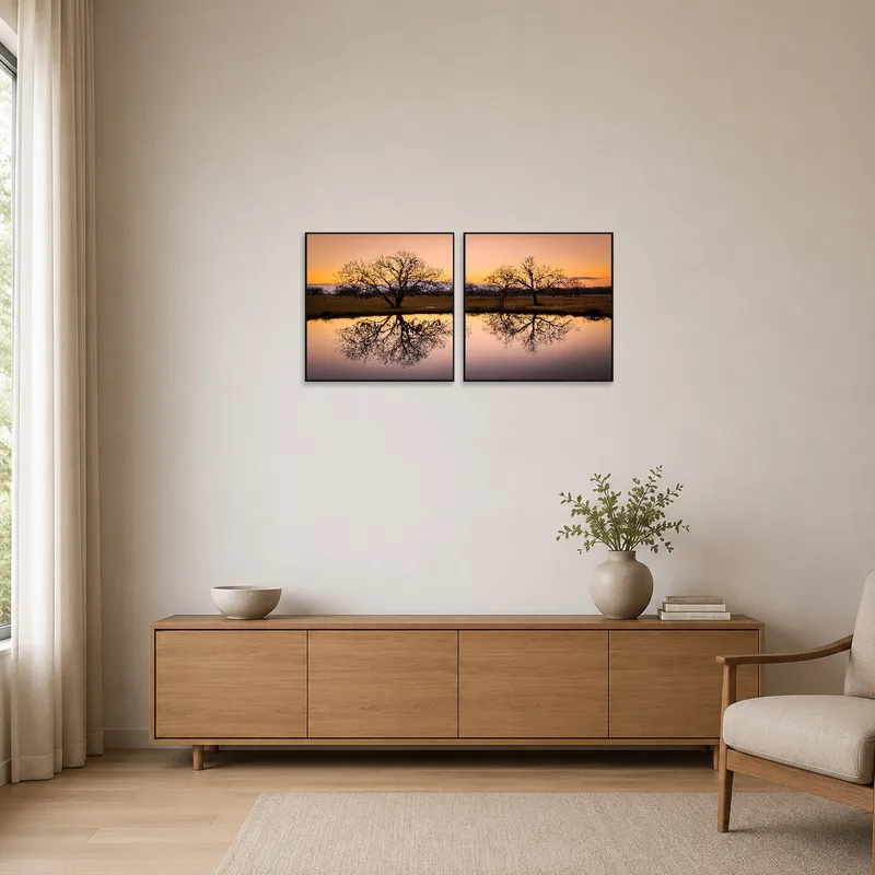 Sunset reflection art on a stark white wall in a minimalist setting.